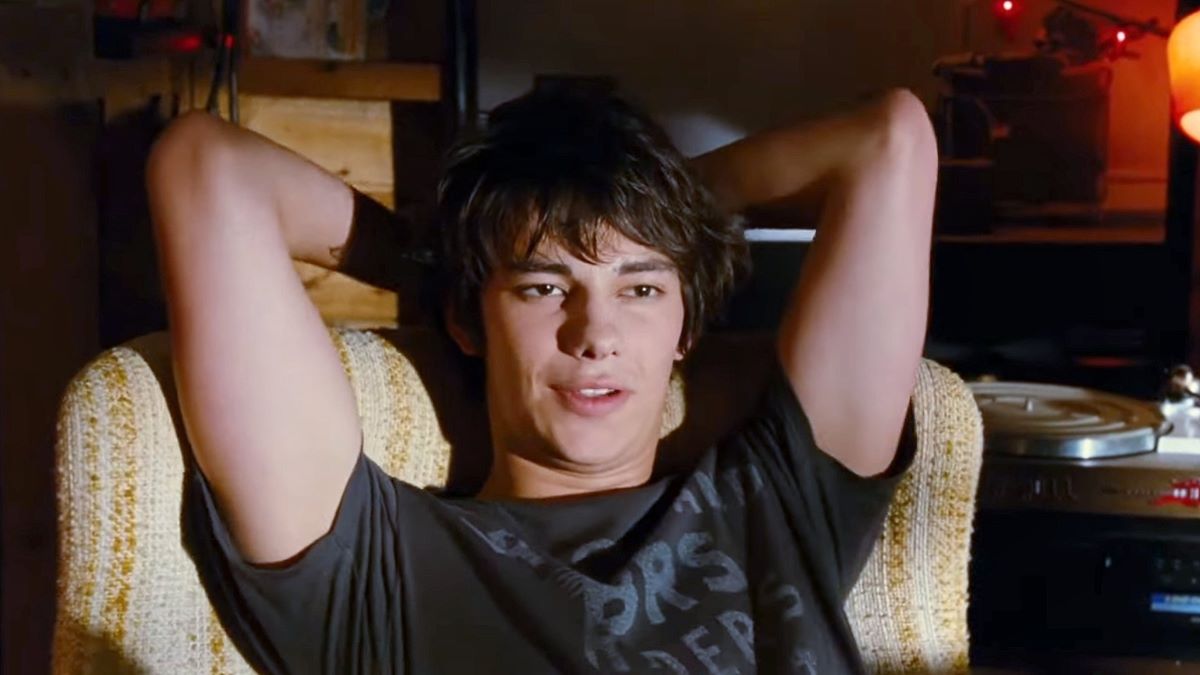 Devon Bostick sleeping with his hands on the back of his head