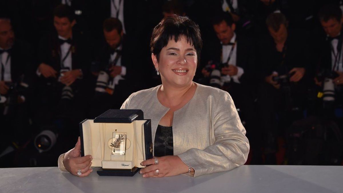 Jaclyn Jose holding her awards