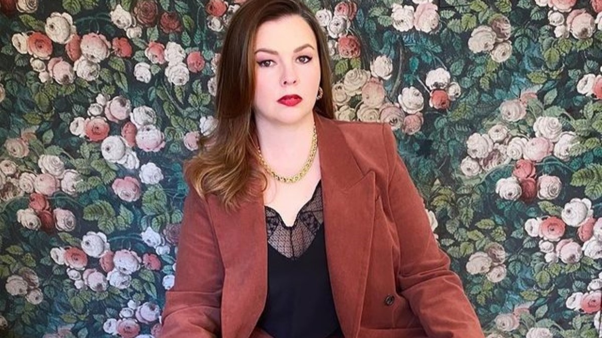 Amber Tamblyn in a brown suit.