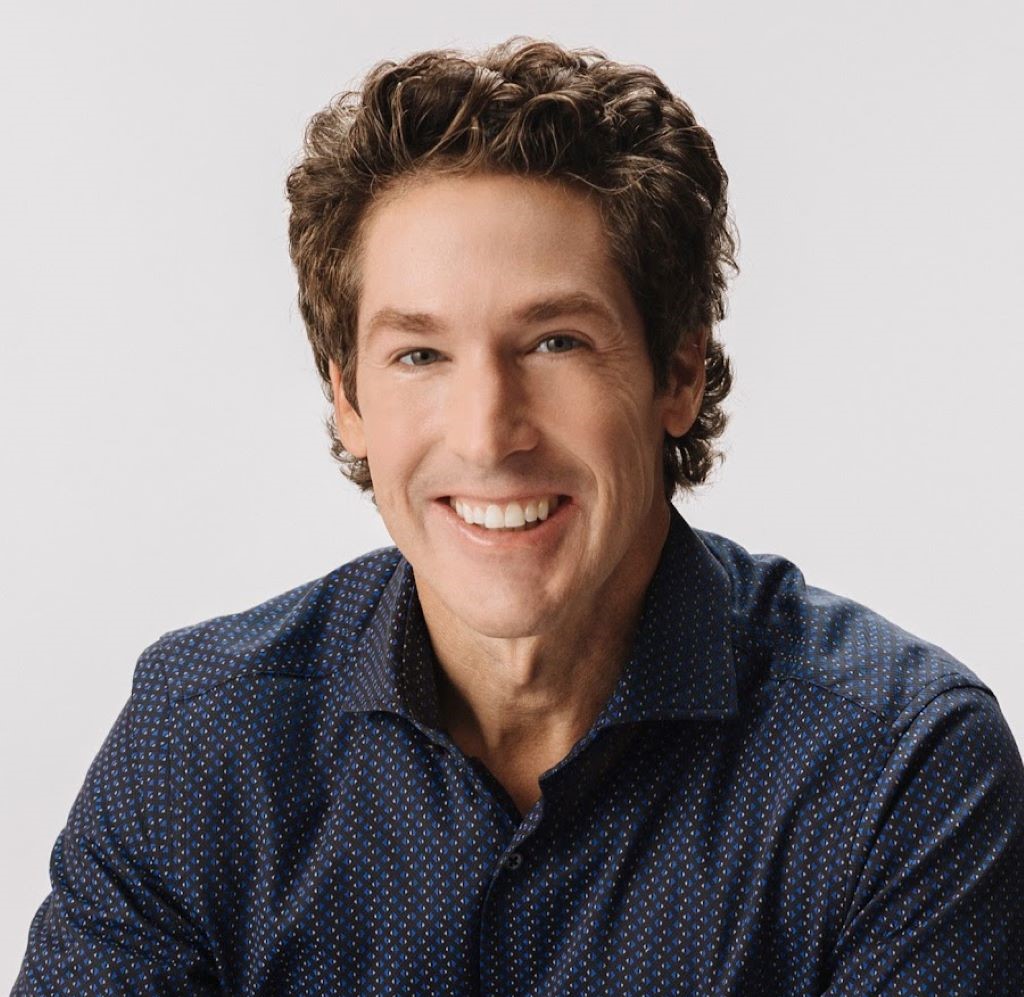 Joel Osteen's picture in white background smiling.